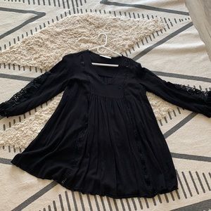 Women’s black smock dress with lace on the sleeves